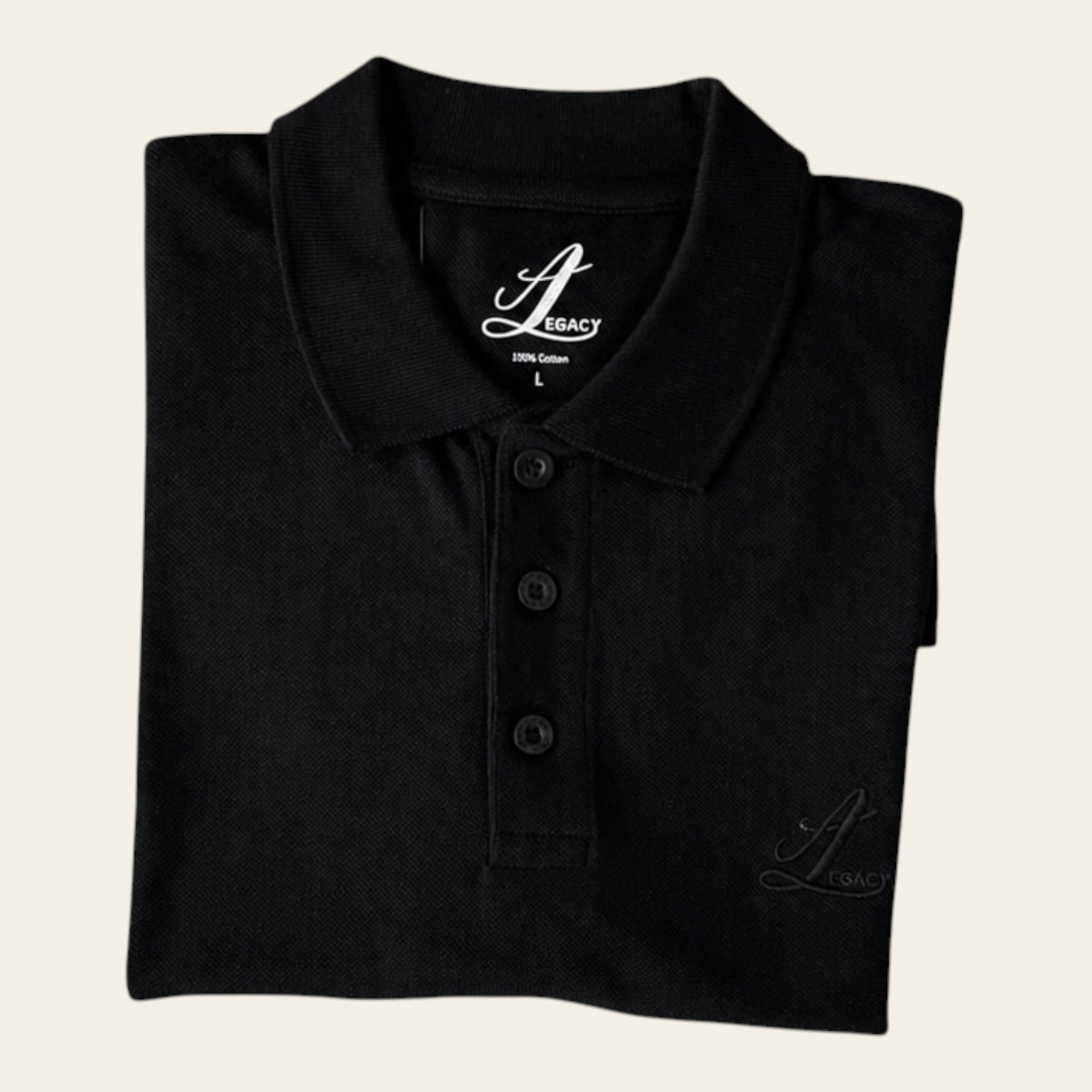 Close-up of rib-knit collar and three-button placket on black organic cotton polo.