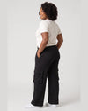 Back and side view of black Legacy cargo pants showing relaxed wide-leg fit and cargo pocket construction.