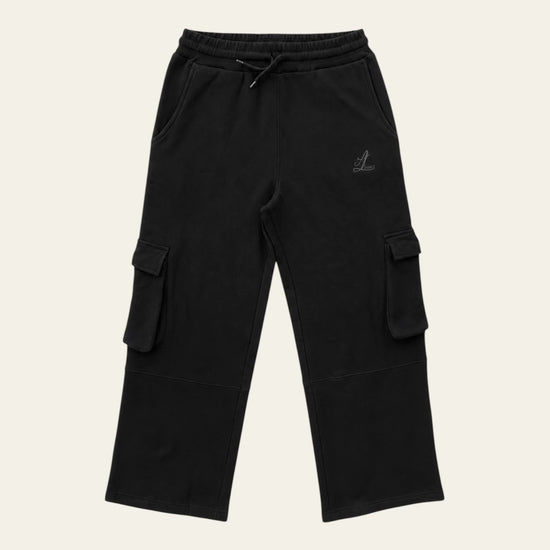 Black Legacy heavyweight organic cotton cargo pants front view with wide legs, drawcord waist and two cargo pockets.