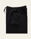 Black Legacy heavyweight organic cotton cargo pants front view with wide legs, drawcord waist and two cargo pockets.