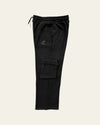Side view of black Legacy cargo pants showing thigh flap pocket, panel seam and relaxed straight leg.