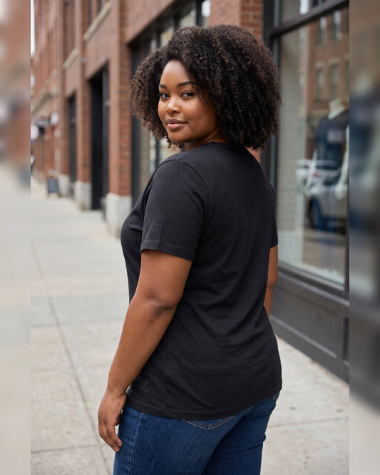 Back view of woman wearing Legacy black V-neck cotton T-shirt
